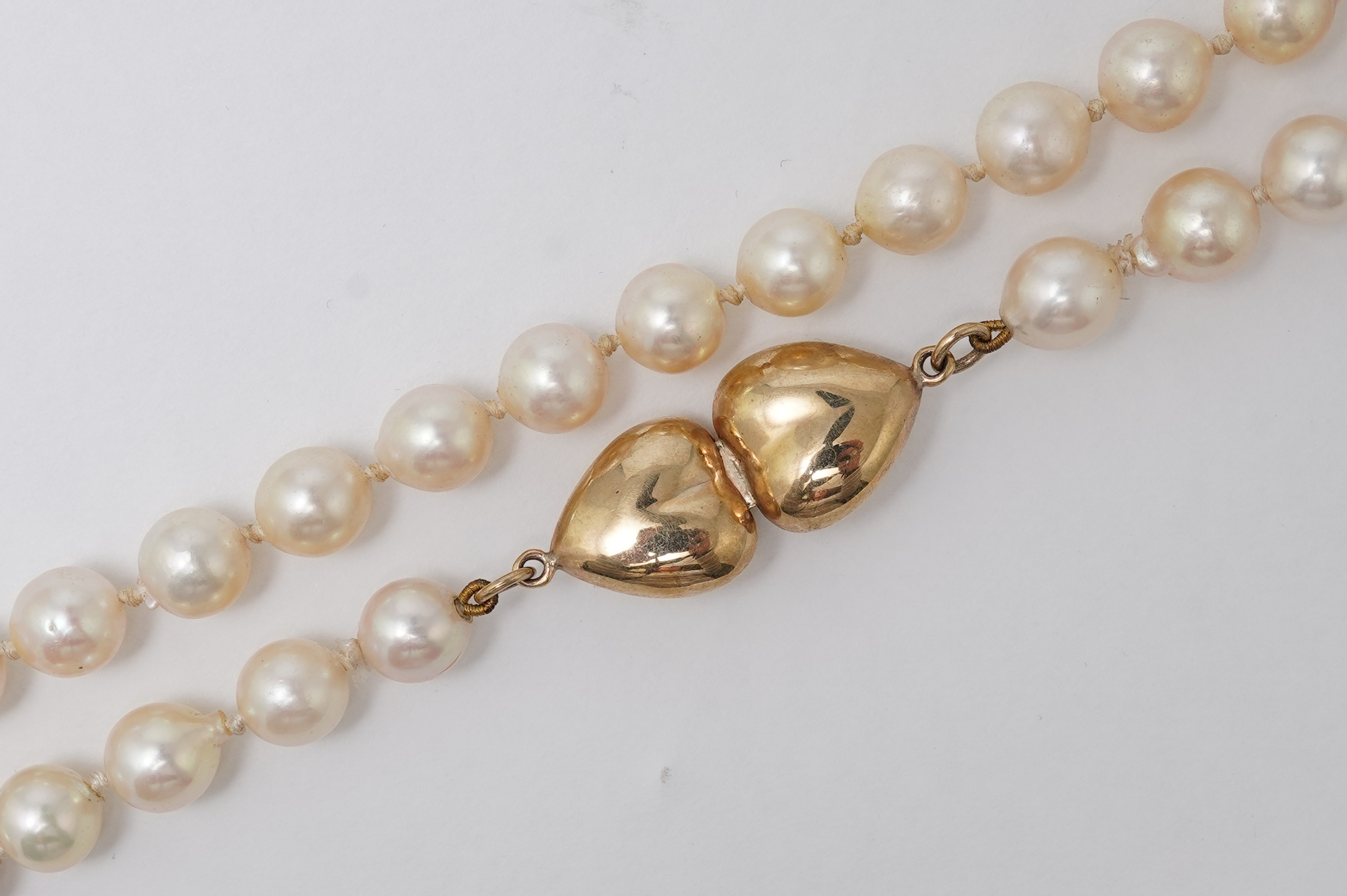 A cultured pearl, gold and diamond necklace